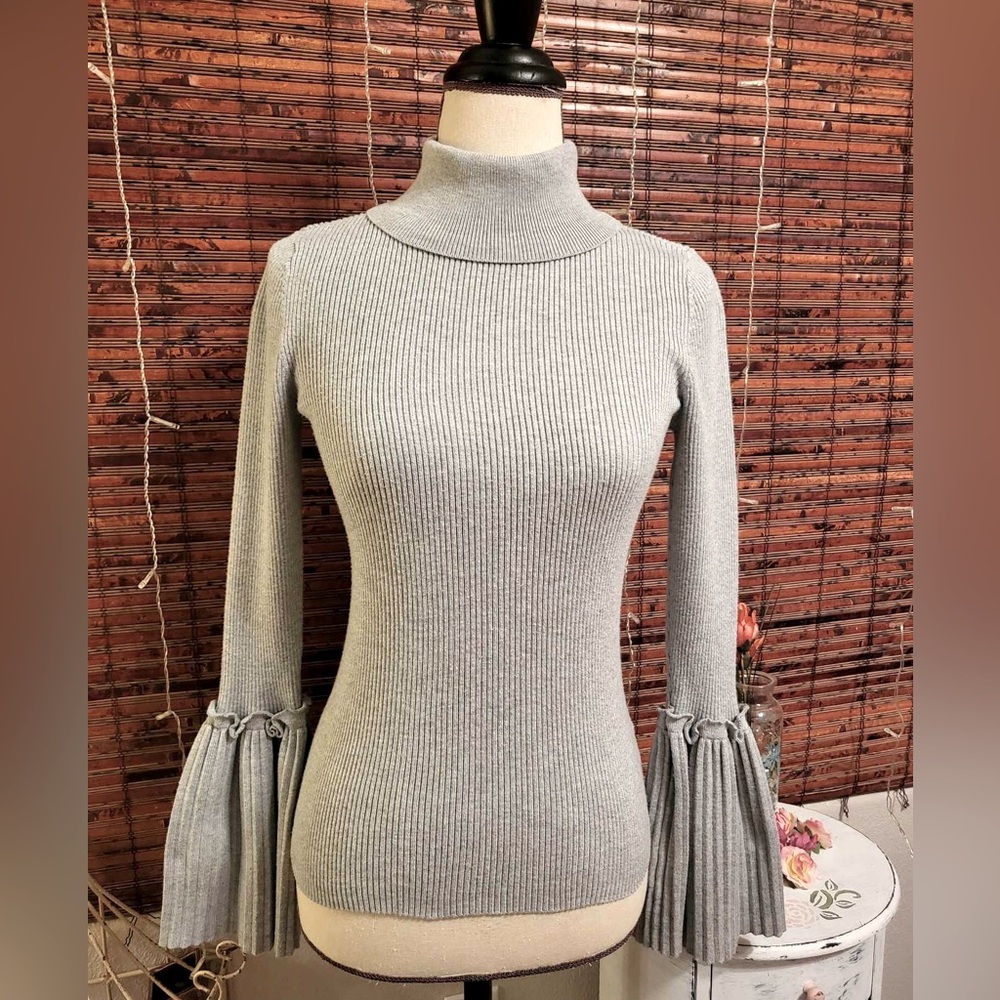 Romeo & Juliet Couture sweater.